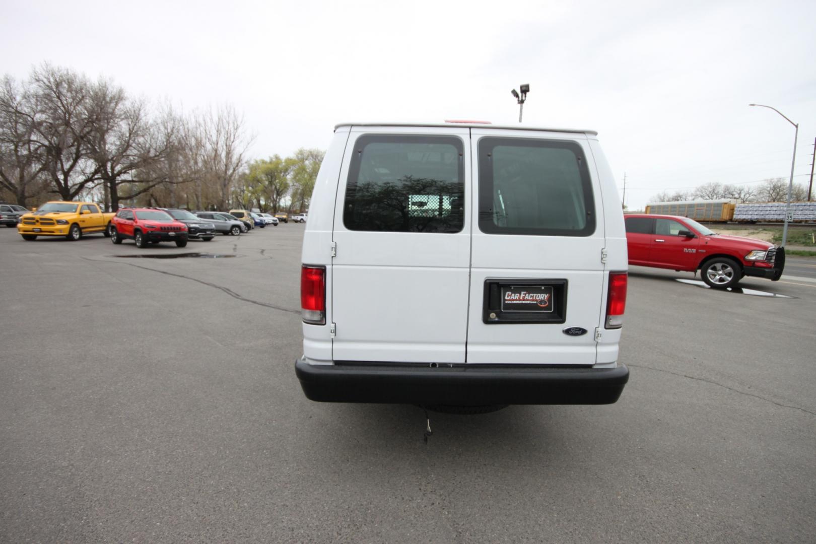 2014 White /Grey Ford E-Series Van (1FTSS3EL3ED) with an 5.4L V8 engine, Automatic transmission, located at 4562 State Avenue, Billings, MT, 59101, (406) 896-9833, 45.769516, -108.526772 - 2014 Ford E-350 Super Duty Extended Cargo Van - One owner - 62,000 miles! 5.4L V8 SOHC 16V FFV Engine - 4 speed automatic transmission - rear wheel drive - 62,752 miles - One owner - Inspected and serviced - Ready to go to work today! Air conditioning - tilt steering wheel - AM/FM audio - powe - Photo#3